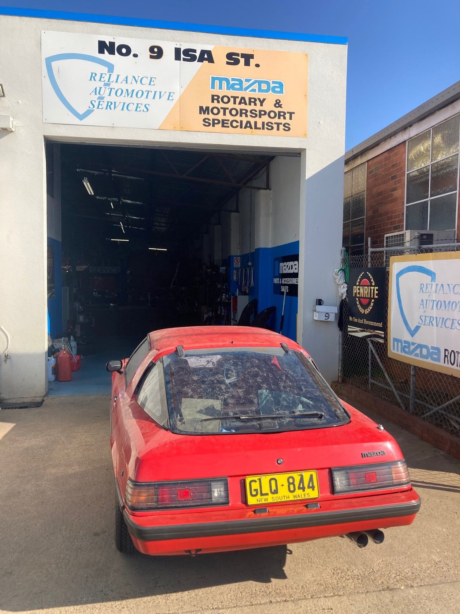 Entering workshop.  The plates were from an RX2 Sedan I had previously owned.