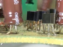What capacitor is on the left? Is that C6? That one looks like it "gave up the ghost". Notice the swelling/deformation along the base.