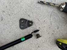 Drilled out the rivet head with a ½” bit just enough to pop it out. 