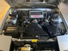 Cleaning up the loose ends, replaced battery box lid that was missing, swapped out the rotary shaped oil cap for a stock one. Replaced the broken hood prop latch.