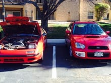 This is a photo of my RX-7 and my daily driver WRX Wagon