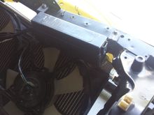 Here's a shot of the tight fit with the relay box - radiator needs to go lower, but that ain't happening unless I do a bit of grinding on the bumper reinforcement - not an option!