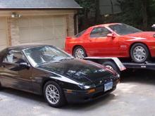 Here's the '90 GTU being hauled away by my friend, parked next to my &quot;new&quot; '88 GTU. A sad day, but I'm glad to know it's living on by donating parts to my friend's '90 GXL.