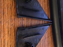 Removed triangles showing typical damage to mounting posts.