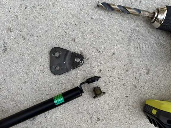 Drilled out the rivet head with a ½” bit just enough to pop it out. 