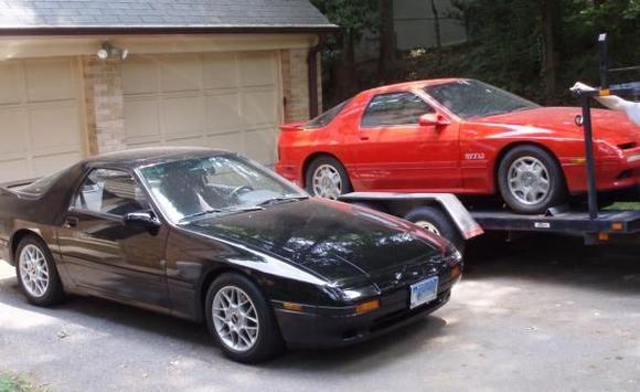 Here's the '90 GTU being hauled away by my friend, parked next to my &quot;new&quot; '88 GTU. A sad day, but I'm glad to know it's living on by donating parts to my friend's '90 GXL.