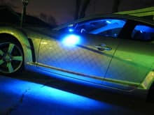 Wired in some custom blue LED Puddle Lights into the side mirrors. (3/14/10)