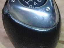 shift knob. that line from the 5 to the R is a reflection, not a scratch...