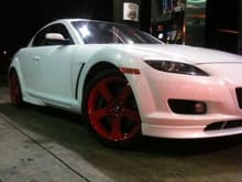 SITTING ON THEM RED RIMS LOOKING NICE
