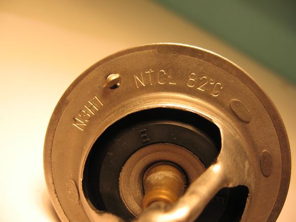 Thermostat removed from 2005 AT RX8. Metal failure. Car was not symptomatic while this was in operation. It was discovered during routine maintenance.