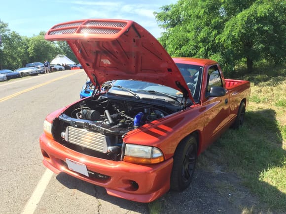 Someone slipped a turbo I4 out of a jeep into this Dakota on lowering springs with a 5sp gearbox. It was... interesting and one of the cooler non-mustang vehicles there.