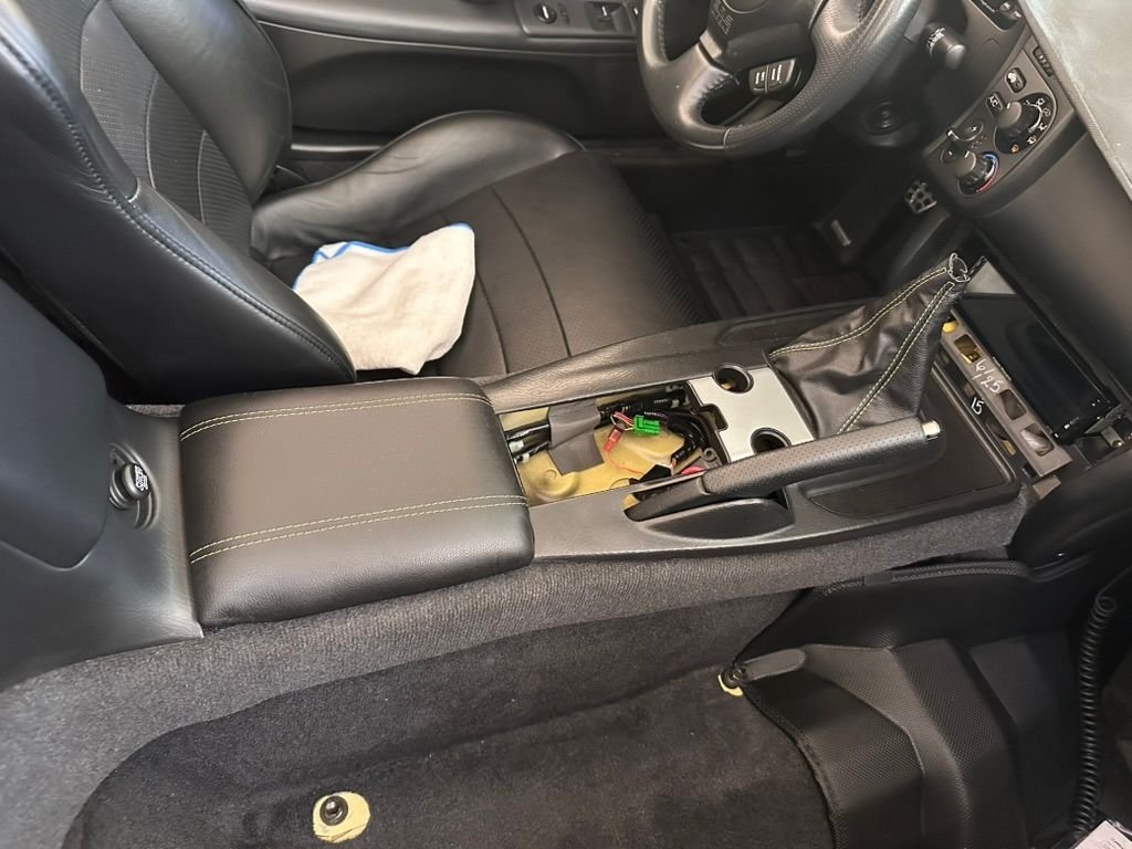 Tested fitted the center console. Thinking of Plasti-dipping or vinyl wrapping the middle trim pieces. 