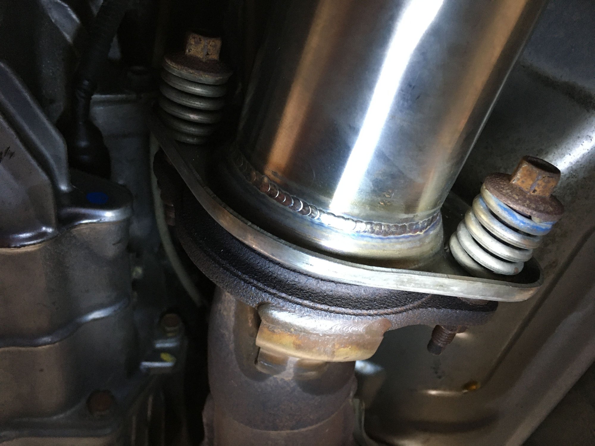 Torqued exhaust spring bolts to 16 lb ft. One spring more compressed