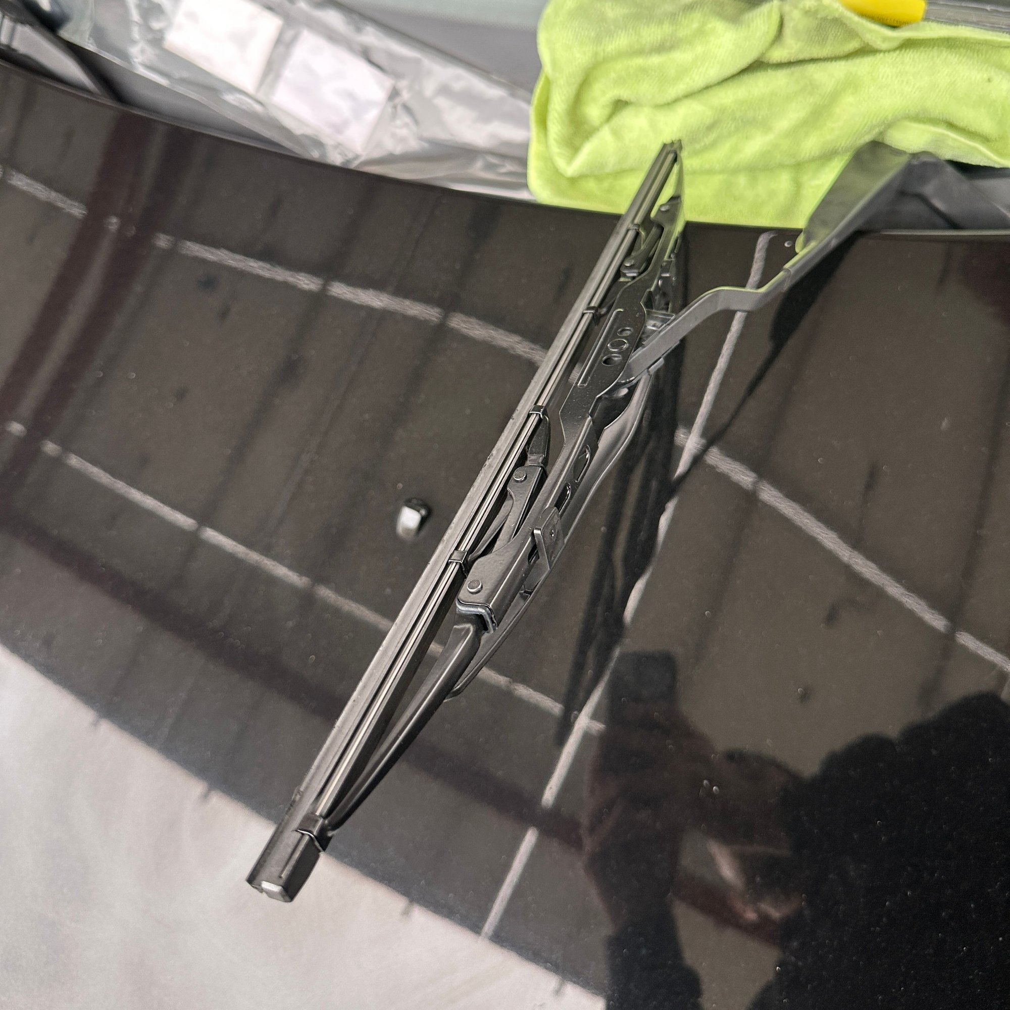 First things first, lift the wiper blade. For the example, Im using the shorter driver-side arm but the longer arm is the same. You do not have to remove the assembly to take off the rubber insert.