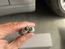Looking at these old plugs, I don't believed the dealer replaced them during the first major service.  The green tip usually indicated it was factory installed.  