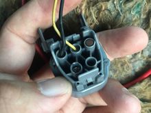 The wire will go into the connector through the back as shown.