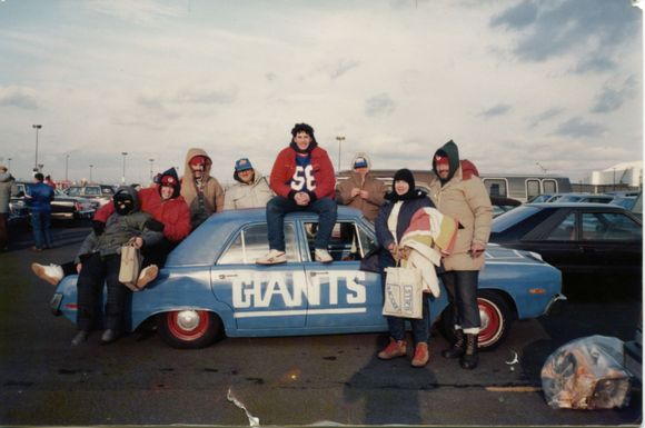 Used about 10 cans of spray paint.  Did 1/2 the car one night at another cousin's garage.  Parked facing away from the house.  Did the other half the 2nd night.  

Mom just shook her head.  Picture taken with family at the NFC Championship game against the Redskins (W, 17-0) in January 1987.  