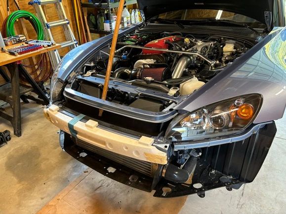 I then had to get rid of the plastic piece beneath the intercooler so that I'd have easy frame access. I had to disconnect the intercooler piping to slide the piece out.