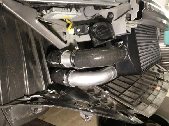 Passenger side I/C piping and silicone pipe wrap by frame rail for rubbing protection / horn relocation