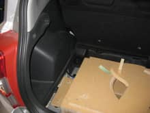 Box in the car with no trim panels.