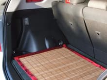Bamboo mat with matching fabric trim.