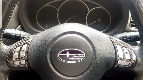 Carbon fiber steering wheel control surround. 