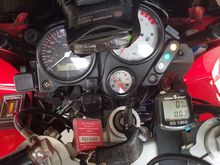 Missing from view is the heated grip switch on the left bar and steering stem mount for a cell phone or GPS which has hard-wired power built into the mount for Micro-USB or Mini-USB,