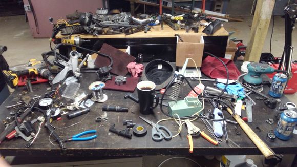 My wife group texted the photo to various family members:

Sister:  I'd hate to be the one to put all that back together.
Brother: Seriously, obviously it's just a pile, if it were a project it would be labeled.
Dad: Yeah, no one actually works like that.
Wife: Guess again, this is normal.  Every bike he has looks like this at some point.