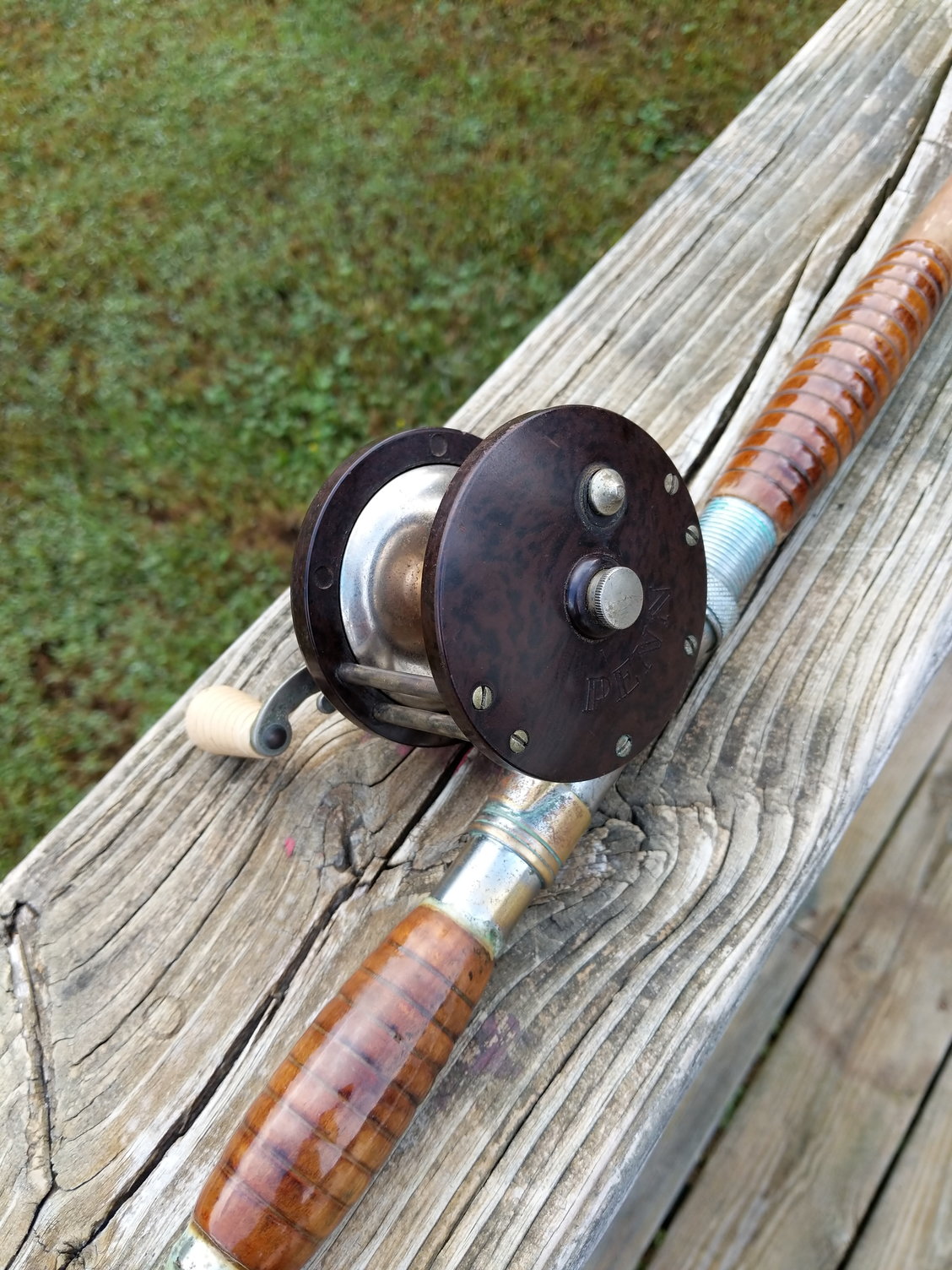 Collection of Vintage Fishing Poles and Reels