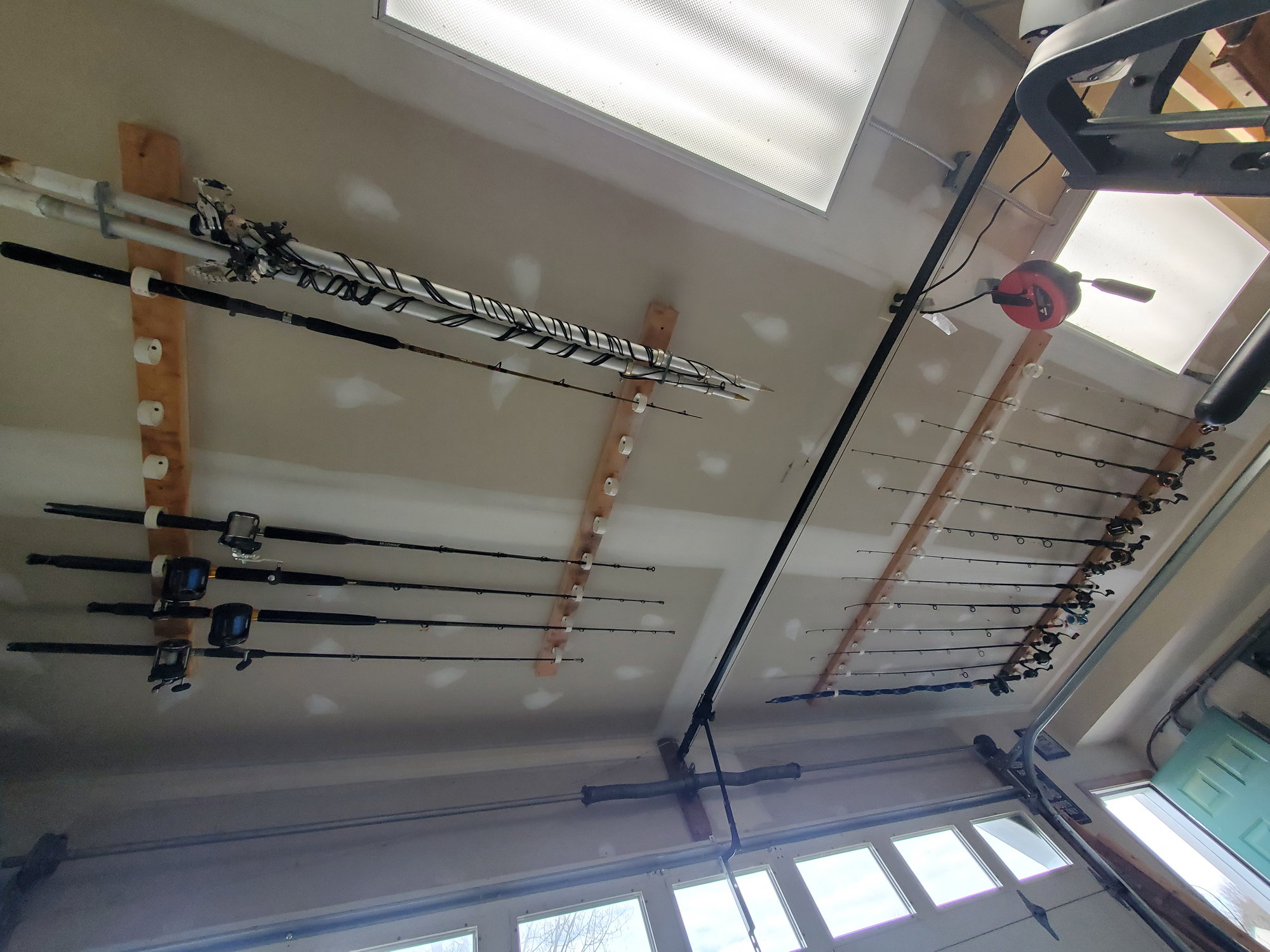Finally took the time to build a rod holder. Nothing too special but I sure  am loving the freed up space in my garage. : r/Fishing