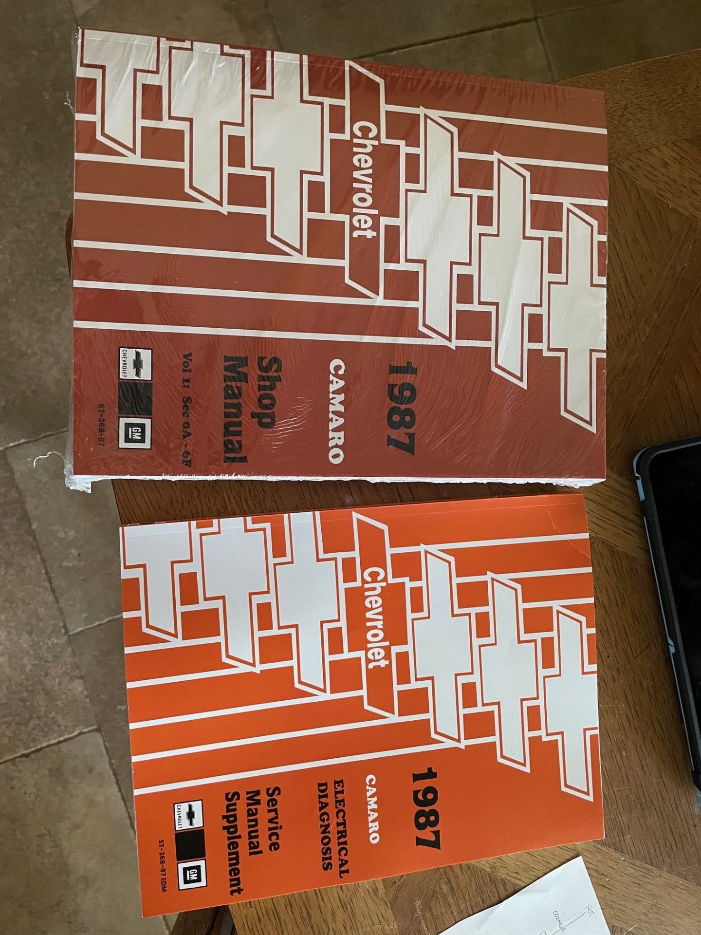 The darker colored manual is actually two different books.