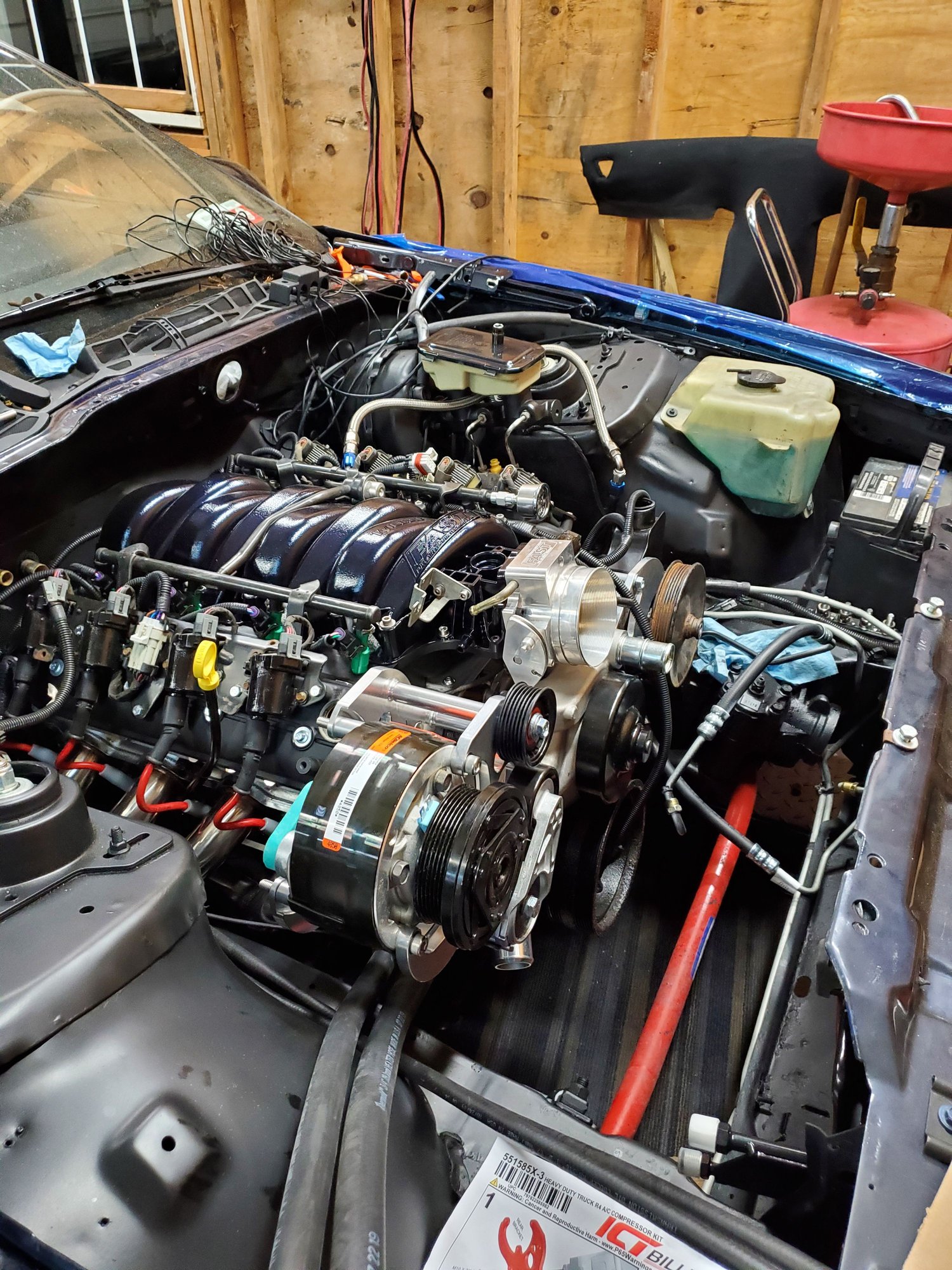 LS3 water pump is the same as truck spacing, Or you can run a water pump spacer with the cheaper fbody pump in truck spacing. This engine has the R4 ac compressor bracket in truck offset