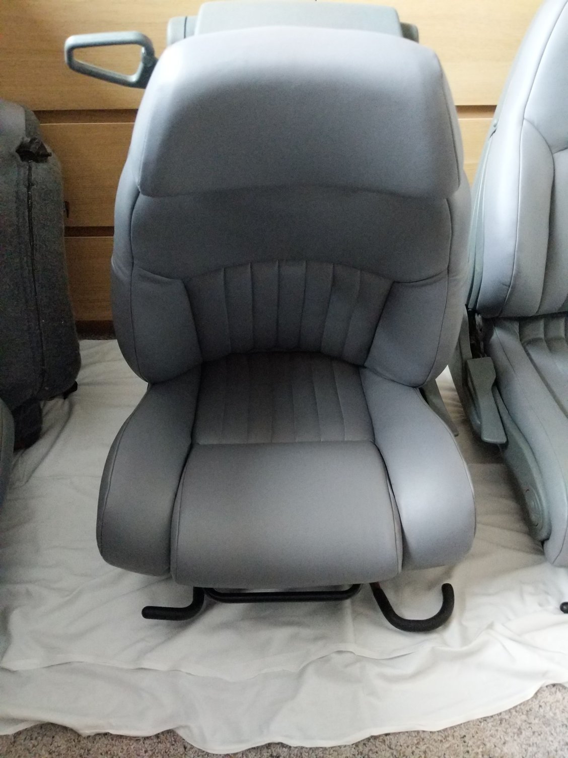 Front driver/passenger seat backs not locking in place Third