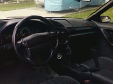 I ditched the Firebird interior and switched to one from a 94 Camaro, including a modified full harness.  I have fully functional vents and hybrid 3rd/4th gen door panels, prototypes for now.  The dash still needs the top cap fabricated.  The gauge in the lower center is for O2 for tuning my Megasquirt.  The red buttons on the steering wheel are for the horn.  Window and mirror controls are on the doors, as are the front speakers.