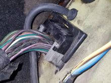 Had planned to go through this area with a hole and grommet, similar to the amplifier power wire that is above the ECU plug.