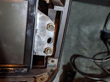 to get it in position I had to reach under the radio and push up as I got the screws tight
