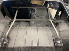 The harness bar will “float” just behind the seats at shoulder height with the attachment bars centered to evenly transfer the load to the cross bar.