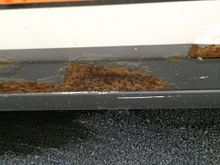 Rust on bottom of drivers door.