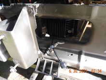 Drilled a mounting hole to center the light in the opening of the louver panel (each side).