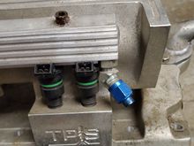 Blue block off cap Passenger Side. I guess since it was a display modle.