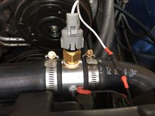 Autometer 2283 with a TS-136 temperature switch for the driver fan.