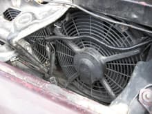 The dual Lexus fans.  They fit perfectly in the space the condenser used to sit, although there is still room to put one back in and re-mount them if I decide to reinstall A/C.  They cover nearly the entire radiator surface, and with the 305 TBI electric fan on the backside a huge amount of airflow moves through the radiator.  The car barely reaches operating temp, even in stop n go traffic on hot, humid days.