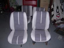 U301 style seats. White vinyl, houndstooth inserts.
