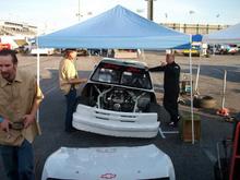 Derek and I after a morning practice run discussing how the car felt. Jason and Rick are are getting the tools ready for changes.