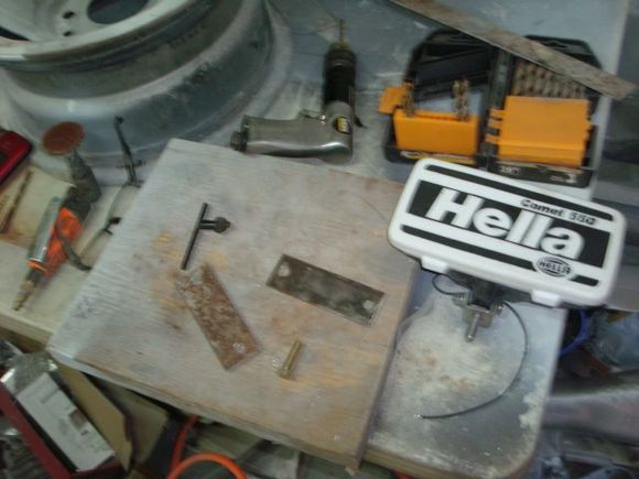 Cut and drilled a set of brackets to mount te Hella lights.