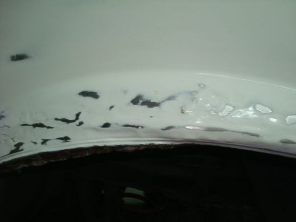 1/2 picture to the right is where I rolled the 3/16 indentation back under into the wheel opening and the left half of the picture shows where it started.