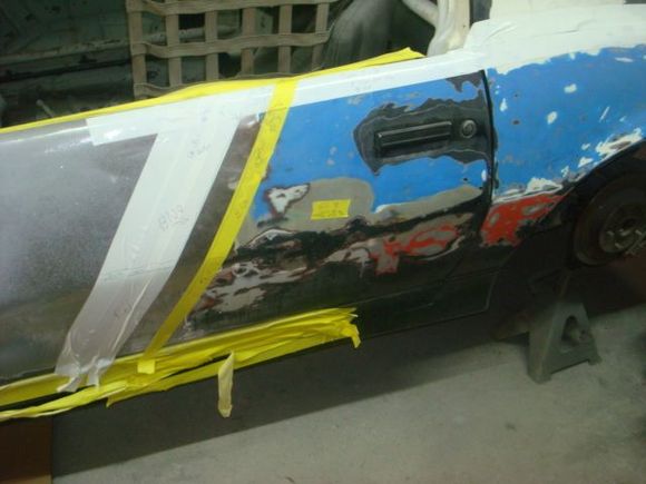 The yellow tape is where the stripes ended when the car was originally painted and decals put on.