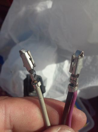What I did with the wire leaving the level sensor, was combine it into the same terminal as the motor's ground wire. On the left is the motor's power wire. Not shown is the pink/purple level sensor input wire.