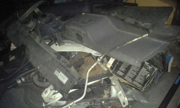 Pile O' Parts under the hatch.  Most of this was from me disassembling the engine after I bought it, since the one it it had been left unprotected for 5 years and got filled with rain water.  Thankfully it was an early 80's non-roller 305, so no big loss.  The only thing missing from the engine was the smog pump (who cares) and heater valve diverter.