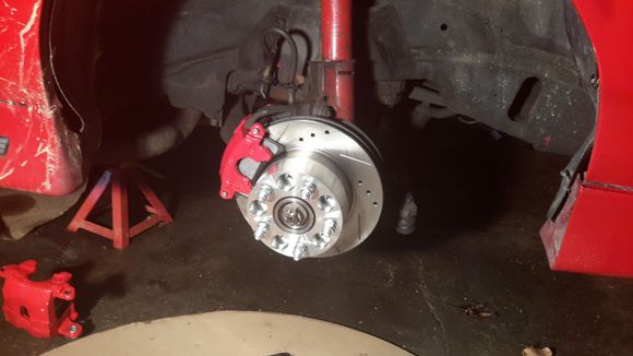 Powerstop kit came with rotors, painted calipers and good pads. Its all stock and only cost $200 for front set. I also have my wheel adapter on. 2" from Hawks.